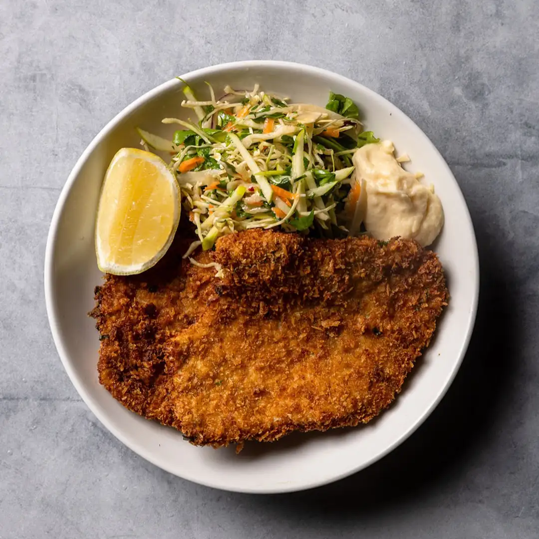 chicken schnitzel and salad