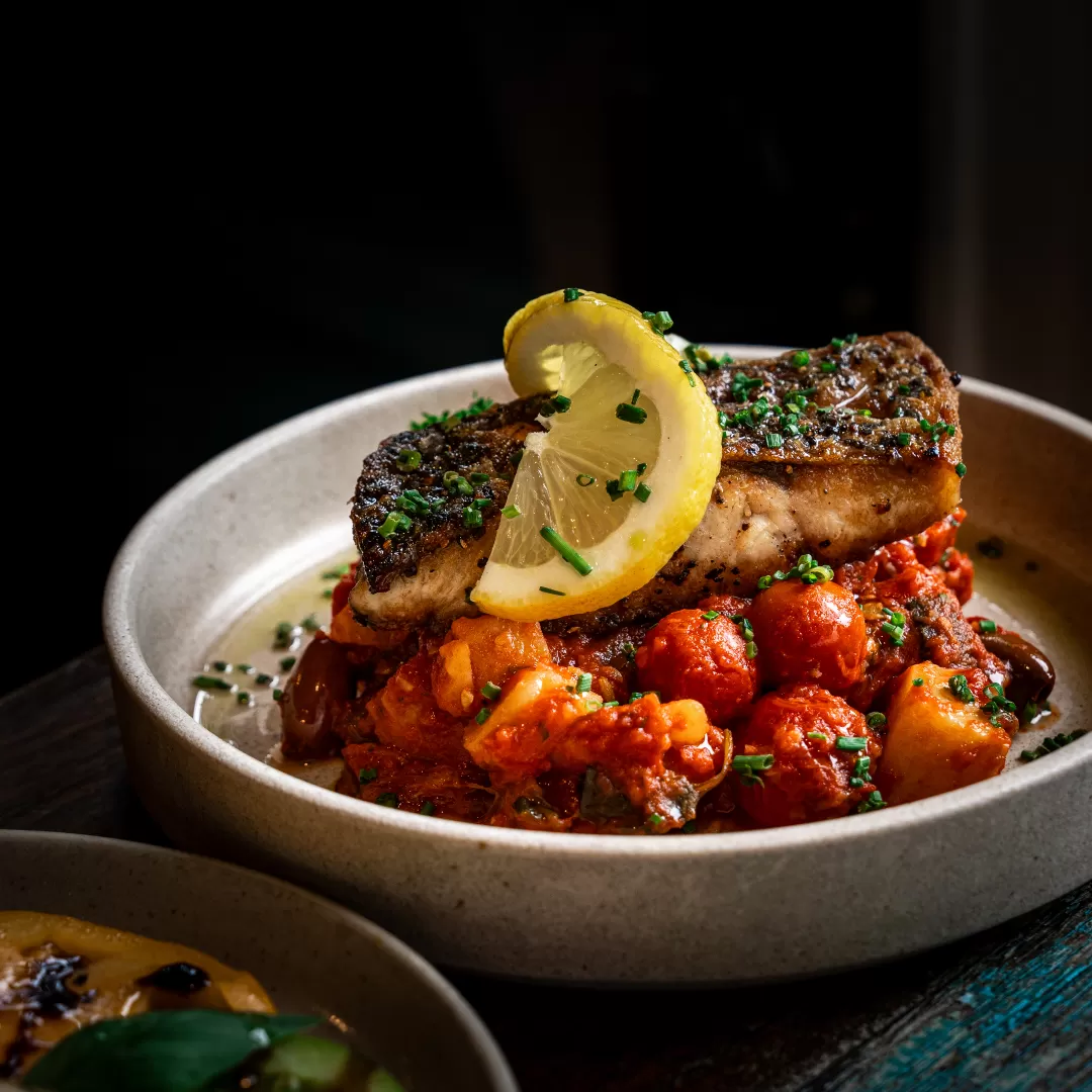fresh fillet with cherry tomatoes, zucchini, spuds & olives